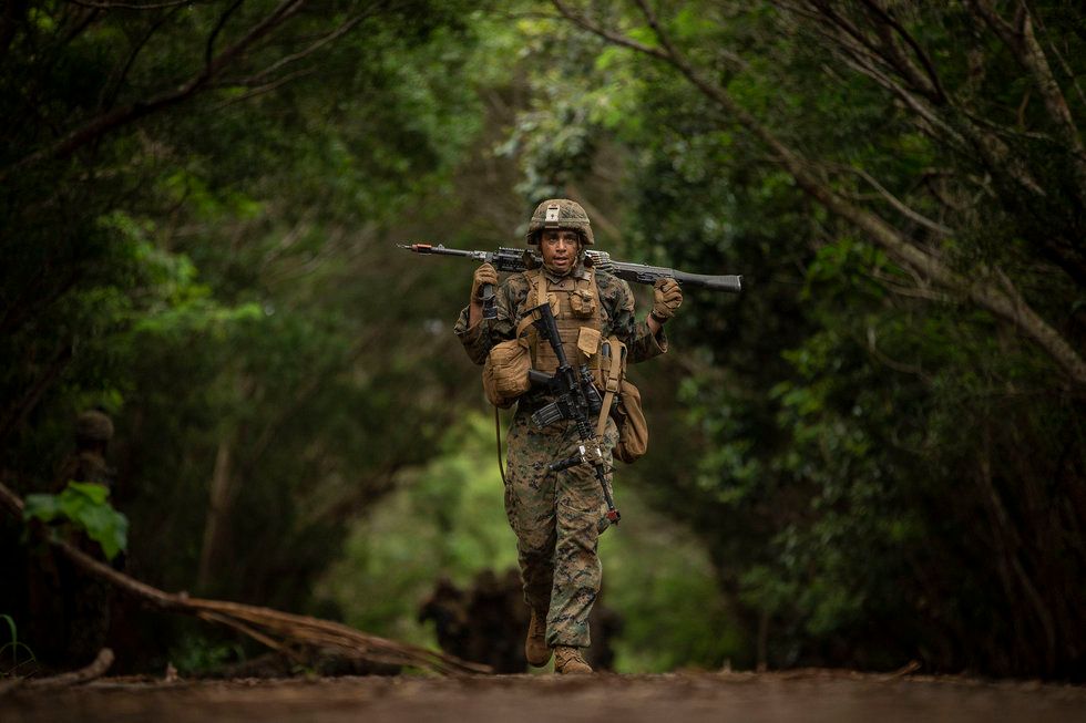 Marine in Fatigues Walking in Woods