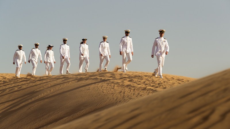 Why the hell are these Dutch sailors strolling through the desert in dress whites?