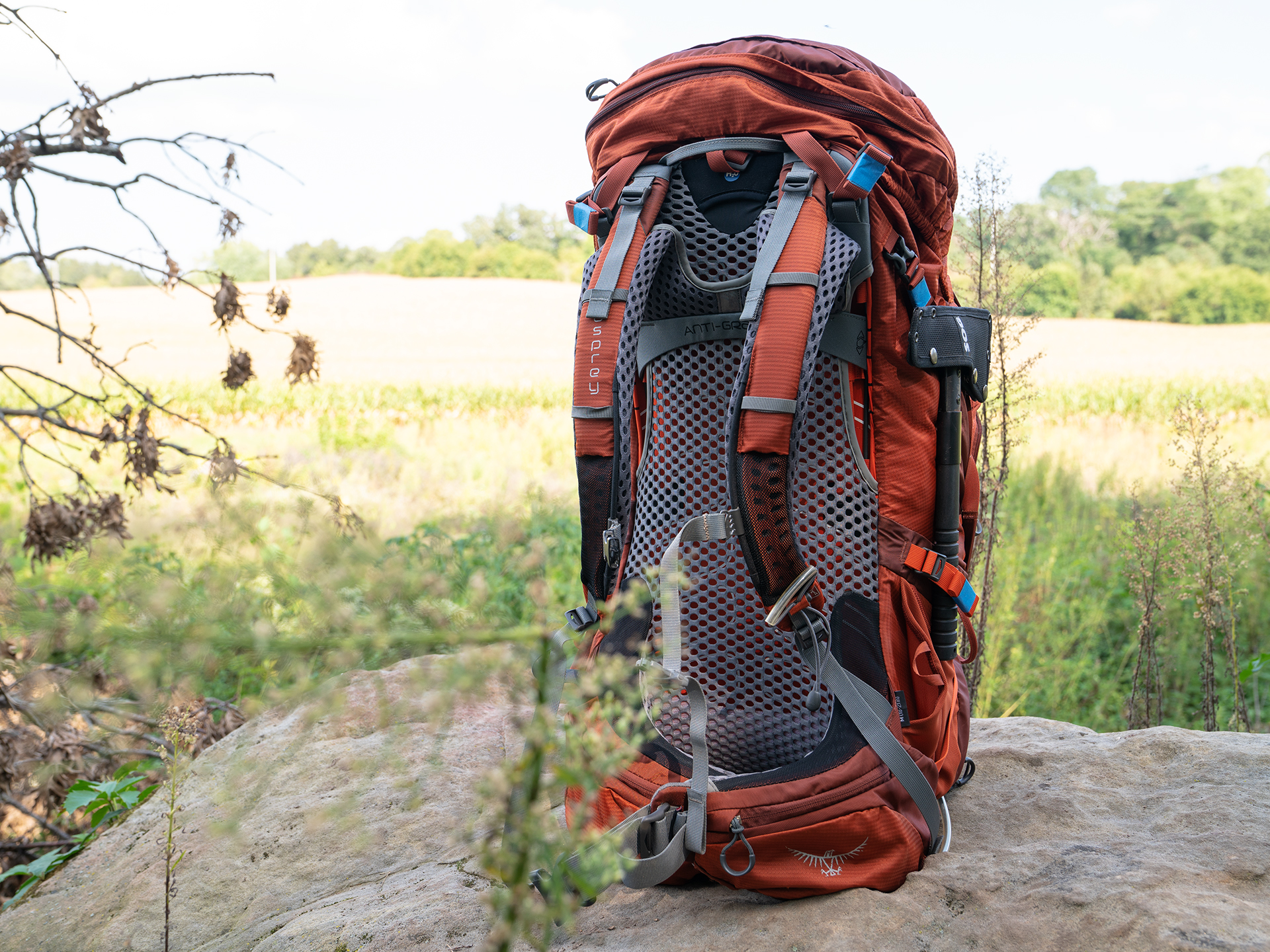 Osprey Atomos 65 AG hiking bag USED ONCE with tags and rain sale cover