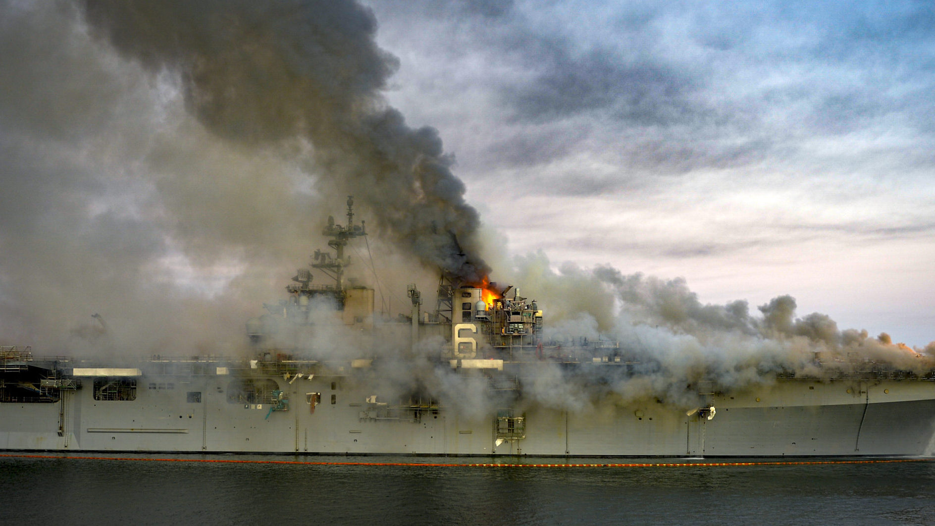 Navy Ship USS Bonhomme Richard Burns At Naval Base In San Diego