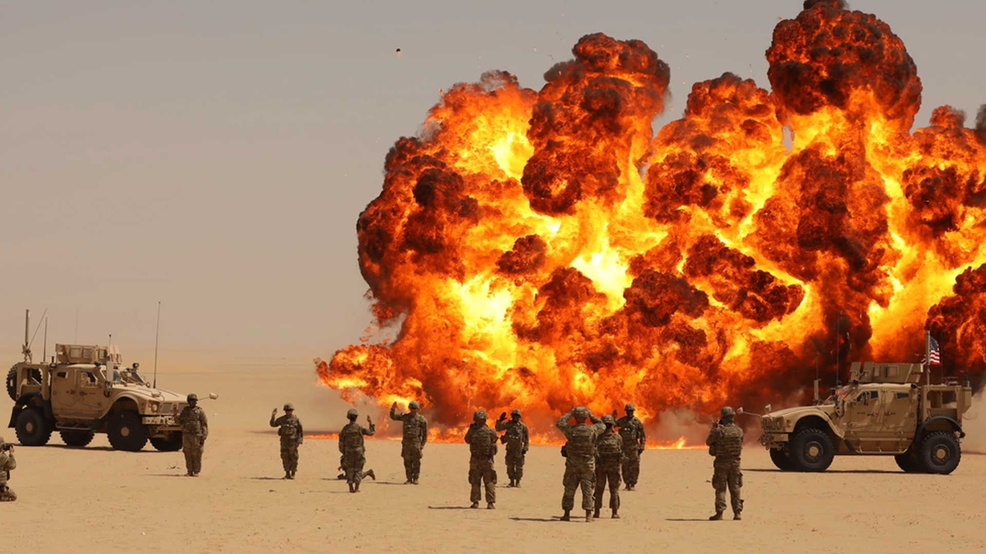 A mass re-enlistment for Soldiers with the Division Special Troops Battalion, 3rd Division Sustainment Brigade and 541st Combat Sustainment Support Battalion, was held on an Explosive Ordnance Disposal Range at Camp Buehring, Kuwait, Sept. 8, 2021. A "fireball" detonation was constructed to make the re-enlistment more memorable. (U.S. Army photo by Spc. Elorina Santos, 3DSB Public Affairs)