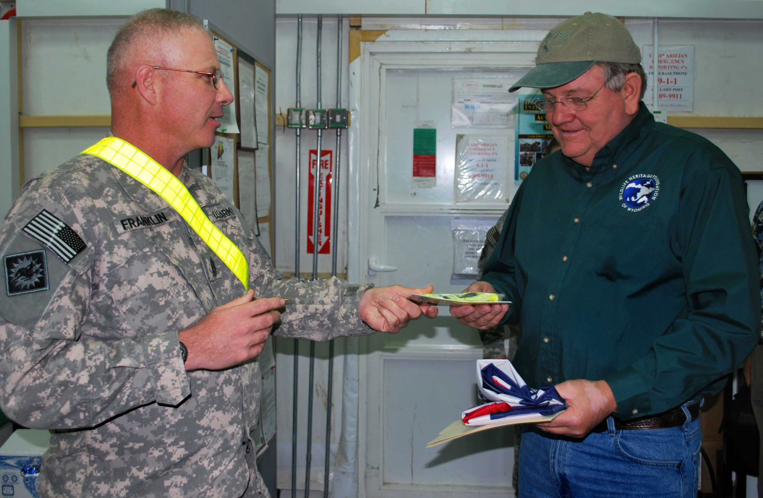 A command sergeant major wears a reflective belt inside.