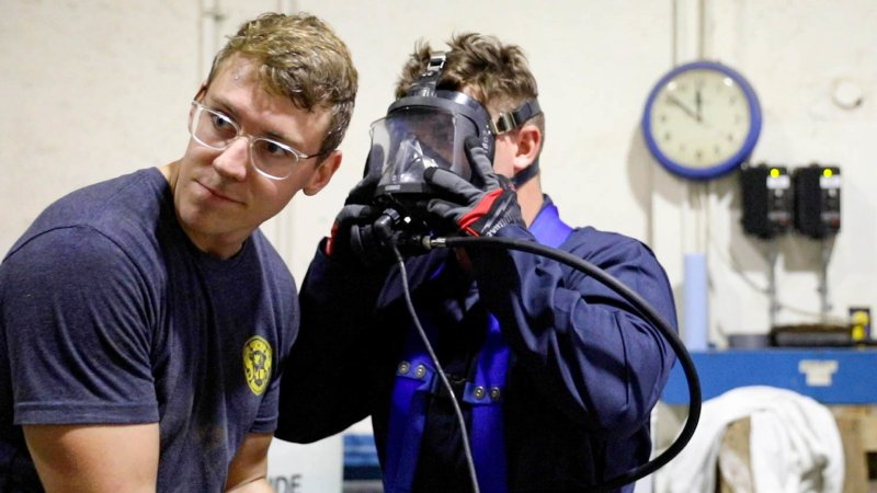 While their families got sick from contaminated water, these Navy divers were tasked with fixing it