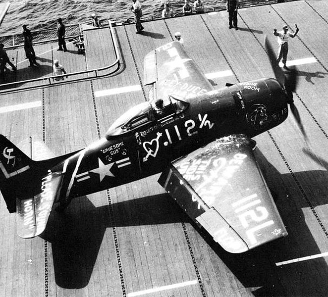 A U.S. Navy Grumman F8F-1 Bearcat of Fighter Squadron 7A (VF-7A) after landing aboard the aircraft carrier USS Leyte (CV-32), in 1947. VF-7A was assigned Carrier Air Group 7 (CVAG-7) aboard the Leyte for a deployment to the Mediterranean Sea from 30 July to 19 November 1947. At that time, it was common aboard U.S. Navy aircraft carriers to "decorate" aircraft of other carriers, that had to land aboard another carrier out of some reason. This particular aircraft probably had to land aboard USS Midway (CVB-41), as Midway, with assigned Carrier Air Group 1 (CVBG-1), was deployed to the Mediterranean Sea from 29 October 1947 to 11 March 1948.