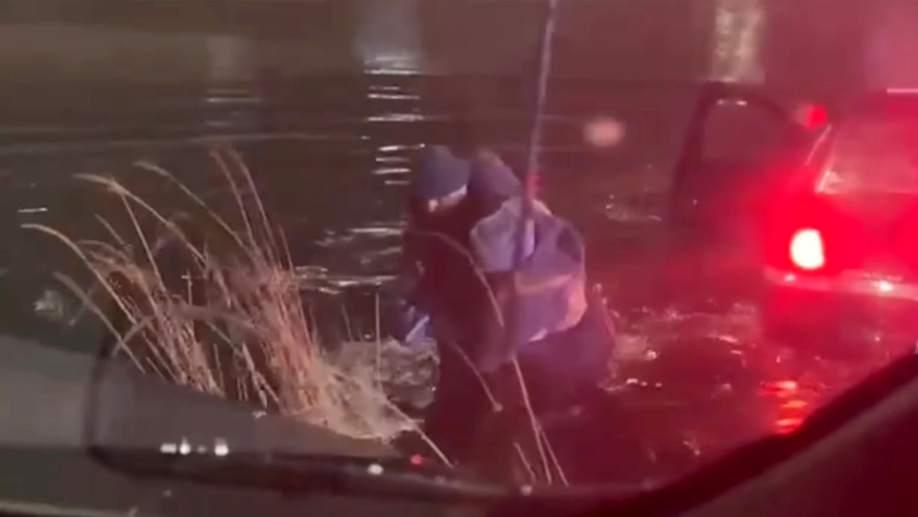 Video shows Marine veteran wading into frigid water to rescue 2 people