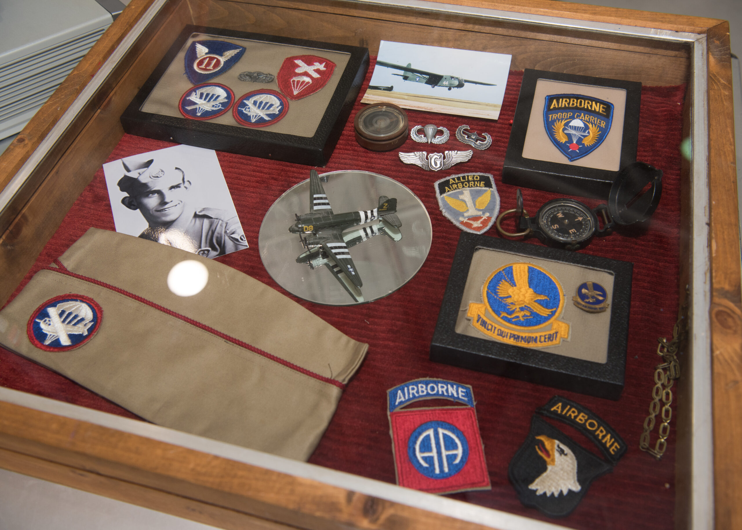 Shadow box display including a Glider Badge.