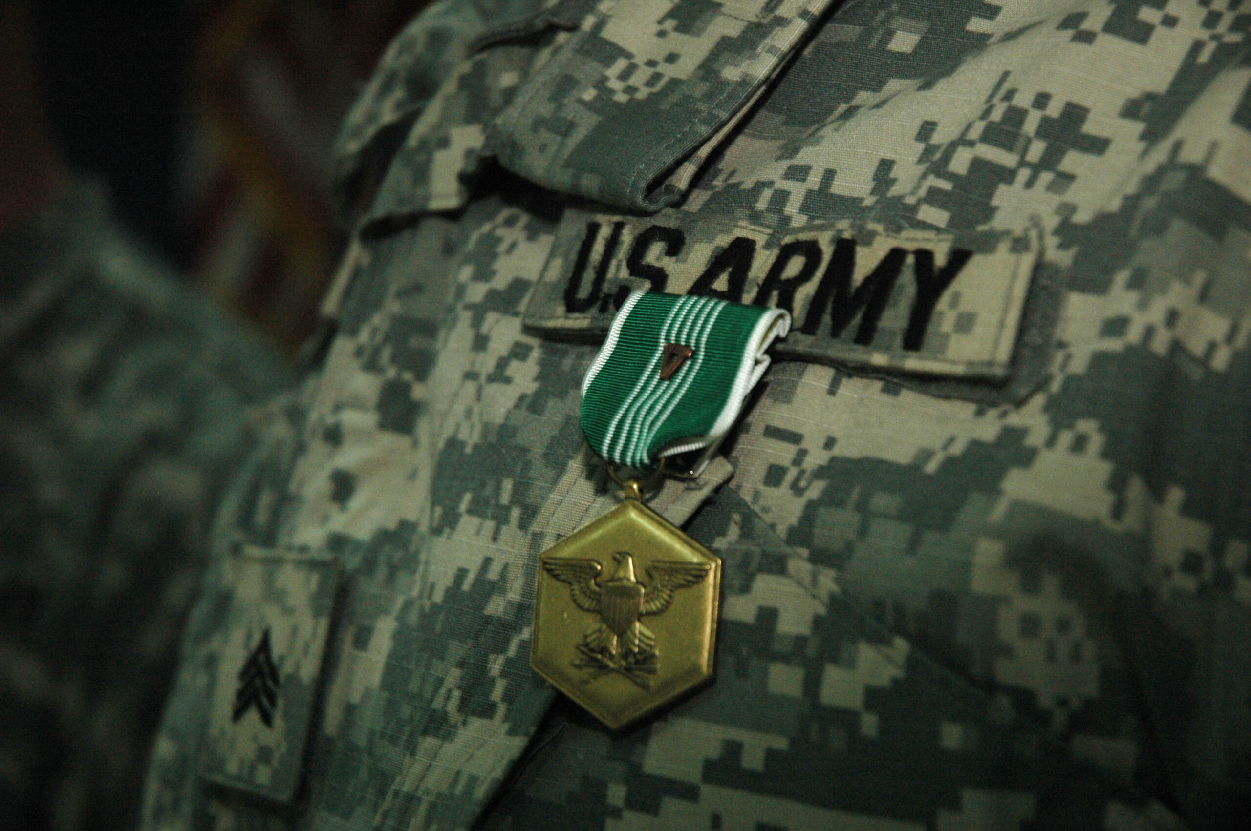 A soldier in Company A, 875th Engineer Battalion, 411th Engineer Brigade receives an Army Commendation Medal with V device during a ceremony at LSA Anaconda on July 27, 2007.