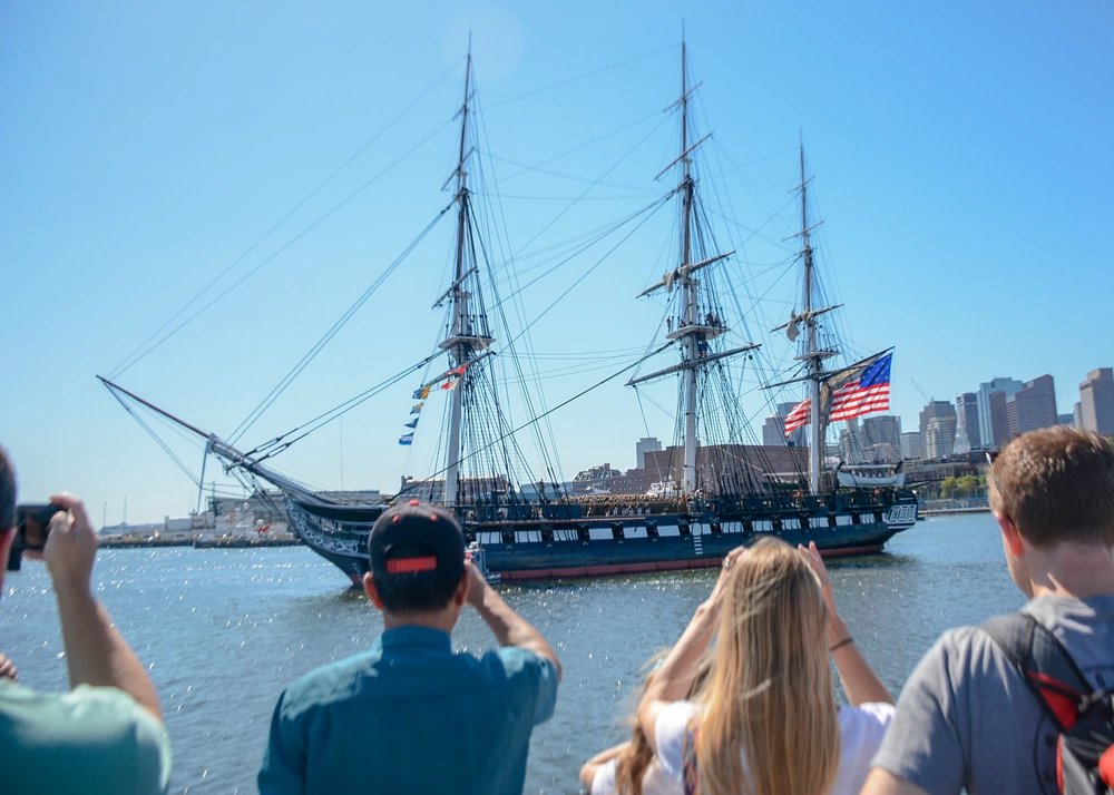 USS Constitution saying around the Boston Harbor.