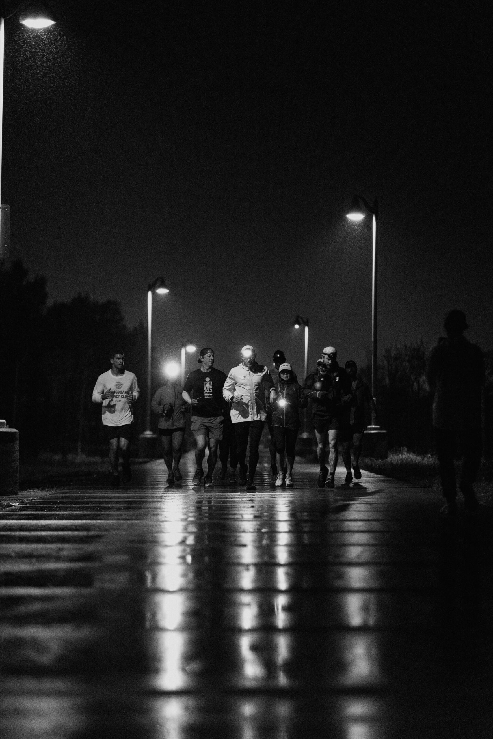 Paul Johnson running with a group at night during his transcontinental run.