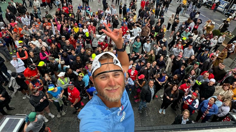 Paul Johnson posing for a photo at Times Square in New York City, New York.