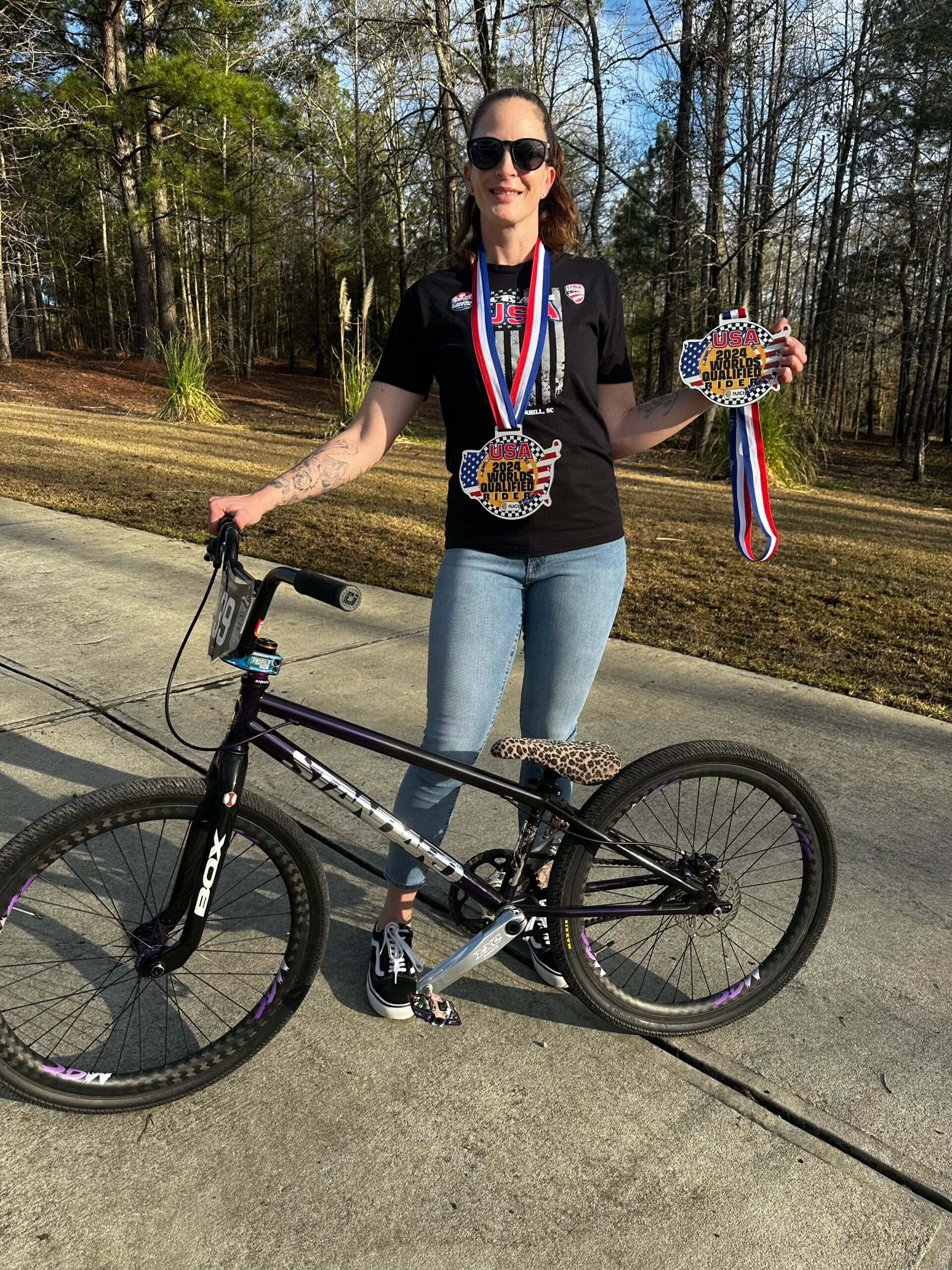 Morgan Brady holding her Team USA qualification medal.