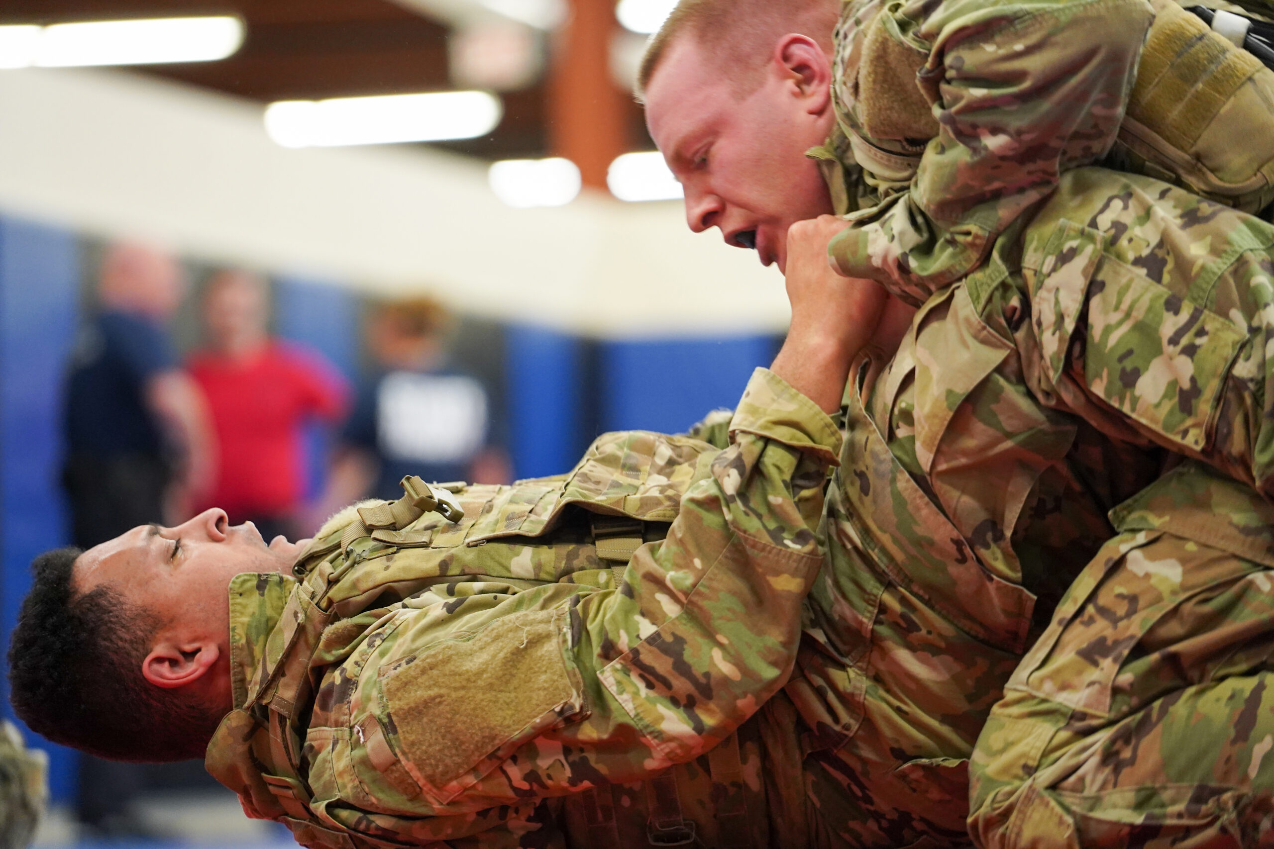 Two soldiers grappling during MACP training.