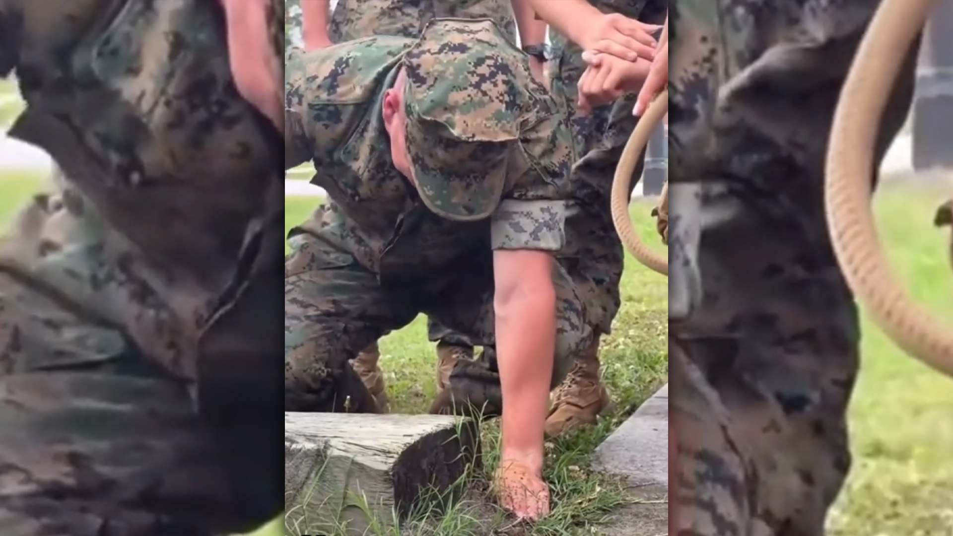 Marine sticking his hand in a fire ant hill.