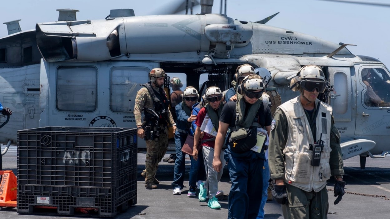Rescued civilian sailors were airlifted by helicopter to the USS Dwight D. Eisenhower Carrier Strike Group on June 15.