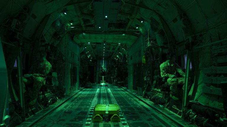 U.S. Air Force Senior Airman Jacob Carpenter, left, and U.S. Air Force Airman 1st Class Jorge Villarreal, loadmasters assigned to the 41st Airlift Squadron, scan the horizon in a U.S. Air Force C-130J Super Hercules assigned to the 19th Airlift Wing above Michigan, May 21, 2021. Mobility Guardian incorporates 1800 personnel across the joint force and the robust integration of 18 mobility aircraft, fighters, bombers, special operations forces and field artillery, dispersed in 6 locations simulating geographically-diverse operating locations to conduct all-domain operations against a highly-capable adversary. (U.S. Air Force photo by Staff Sgt. Joseph Pick)