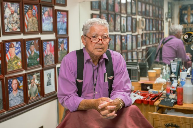 Travis Bell, XVIII Airborne Corps barber, poses for a photo in his barbershop at Fort Liberty, N.C., June 20, 2024. In recognition for providing a lifetime of consistent, quality haircuts for Soldiers at Fort Liberty, Travis Bell, XVIII Airborne Corps barber, will be inducted into The National Barber Museum and Hall of Fame, September 2024. (U.S. Army Photo by Pfc. Jason Sessions)