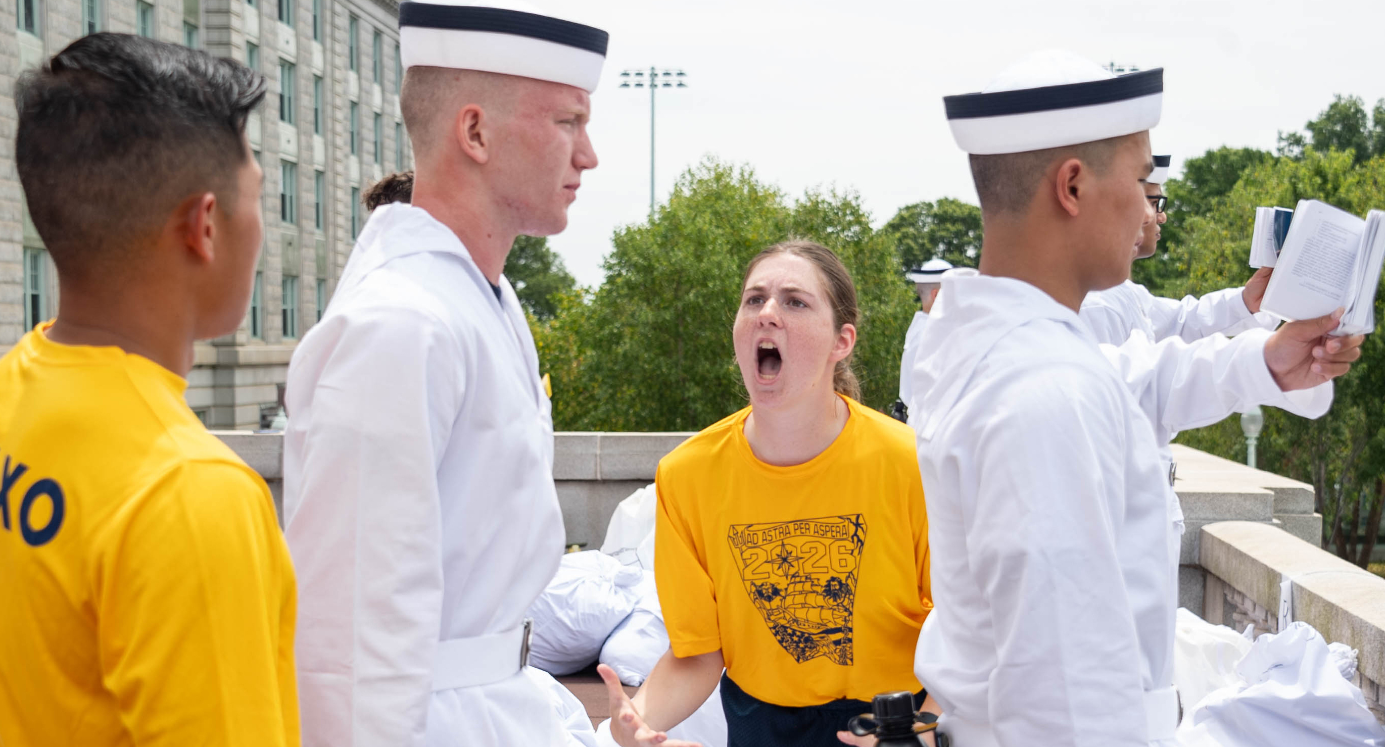 ANNAPOLIS, Md. (June 27, 2024) U.S. Naval Academy midshipman candidates, or plebes, of the class of 2028 receive instruction from detailers during I-Day which marks the beginning of a demanding six-week indoctrination period called Plebe Summer that is intended to transition the candidates from civilian to military life. As the undergraduate college of our country’s naval service, the Naval Academy prepares young men and women to become professional officers of competence, character, and compassion in the U.S. Navy and Marine Corps. (U.S. Navy photo by Stacy Godfrey) (This photo has been altered for security purposes by blurring out identification numbers.)