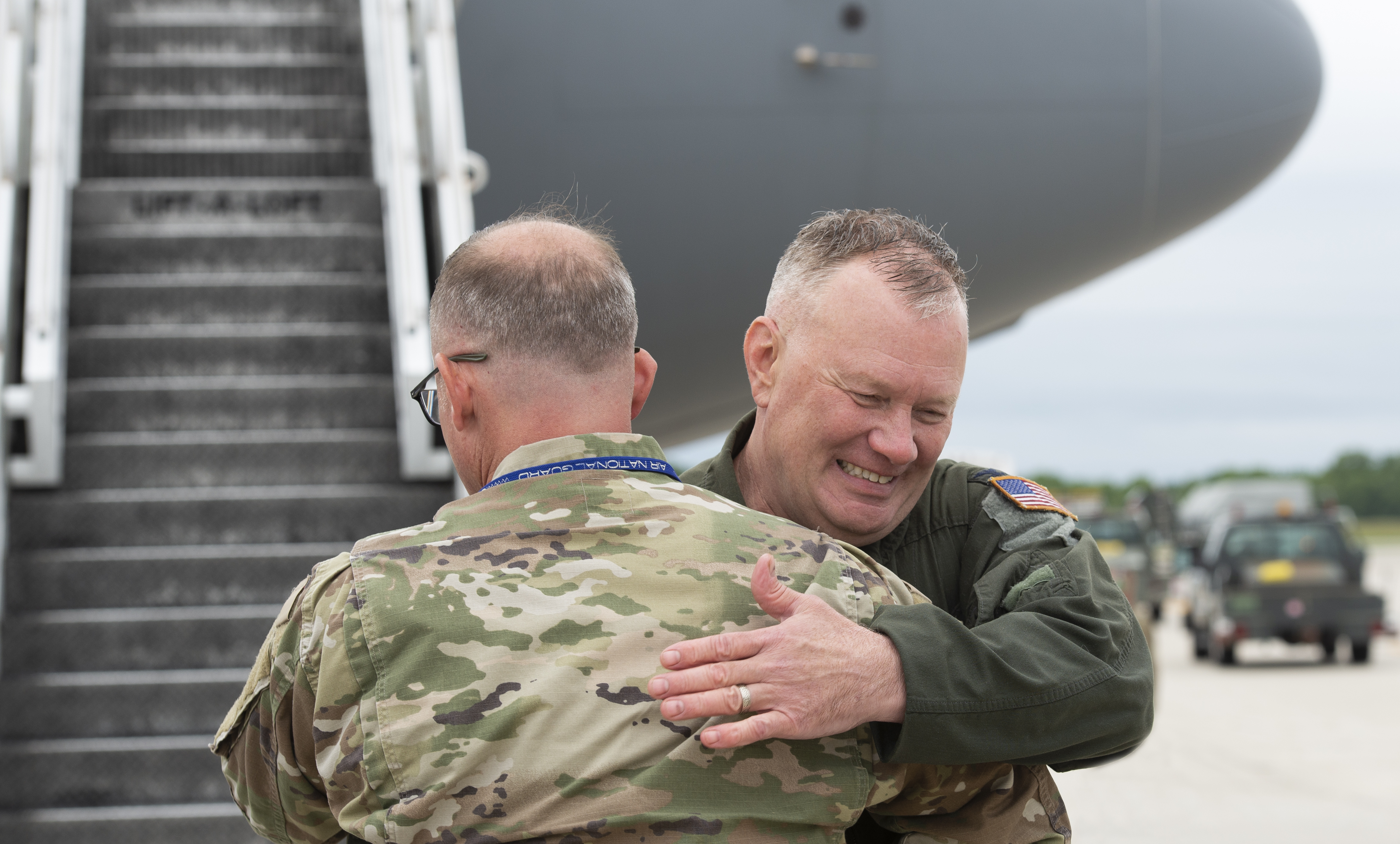 157th Air Refueling Wing Commander, Col. John Pogorek, is congratulated by Chief Master Sgt. Jason Veziris, the Airfield Management Superintendent with the 157th Operations Group, on the flight line after landing his fini-flight at Pease Air National Guard Base, New Hampshire June 2, 2022. Pogorek flew more than 6,675 flying hours with the U.S. Air Force and New Hampshire Air National Guard. (U.S. photo by Staff Sgt. Victoria Nelson)