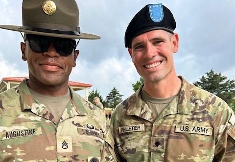 U.S. Army Reserve Spc. Jason Pelletier (right) gets a photograph with his Drill Sergeant after graduating from U.S. Army Basic Combat Training.