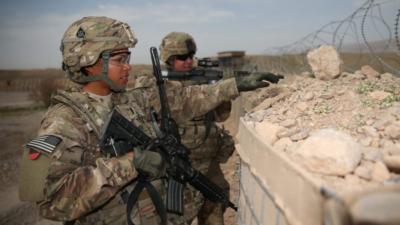 U.S. Army 1st Lt. Audrey Griffith, left, points to an area of interest while standing guard with Spc. Heidi Gerke during a force protection exercise at Forward Operating Base Hadrian in Uruzgan province, Afghanistan, March 18, 2013. Both women are members of the 92nd Engineer Battalion. (U.S. Army courtesy photo/Released)