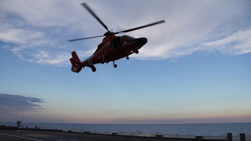 A rescue helicopter and its crew from Coast Guard Air Station Detroit carry out a training exercise in 2012. (photo courtesy U.S. Coast Guard)