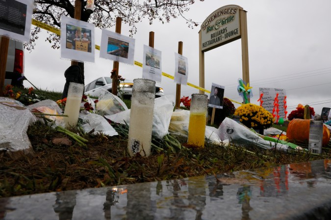Lewiston, ME - October 30: A makeshift memorial grows outside of Schemengees Bar & Grille one of two locations where a mass shooting killed 18 people. (Photo by Jessica Rinaldi/The Boston Globe via Getty Images)
