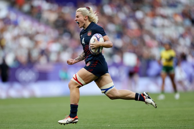 PARIS, FRANCE - JULY 28: Sammy Sullivan #4 of Team United States celebrates as she runs in to score her team's second try during the Women’s Pool C match between Team United States and Team Brazil on day two of the Olympic Games Paris 2024 at Stade de France on July 28, 2024 in Paris, France. (Photo by Hannah Peters/Getty Images)
