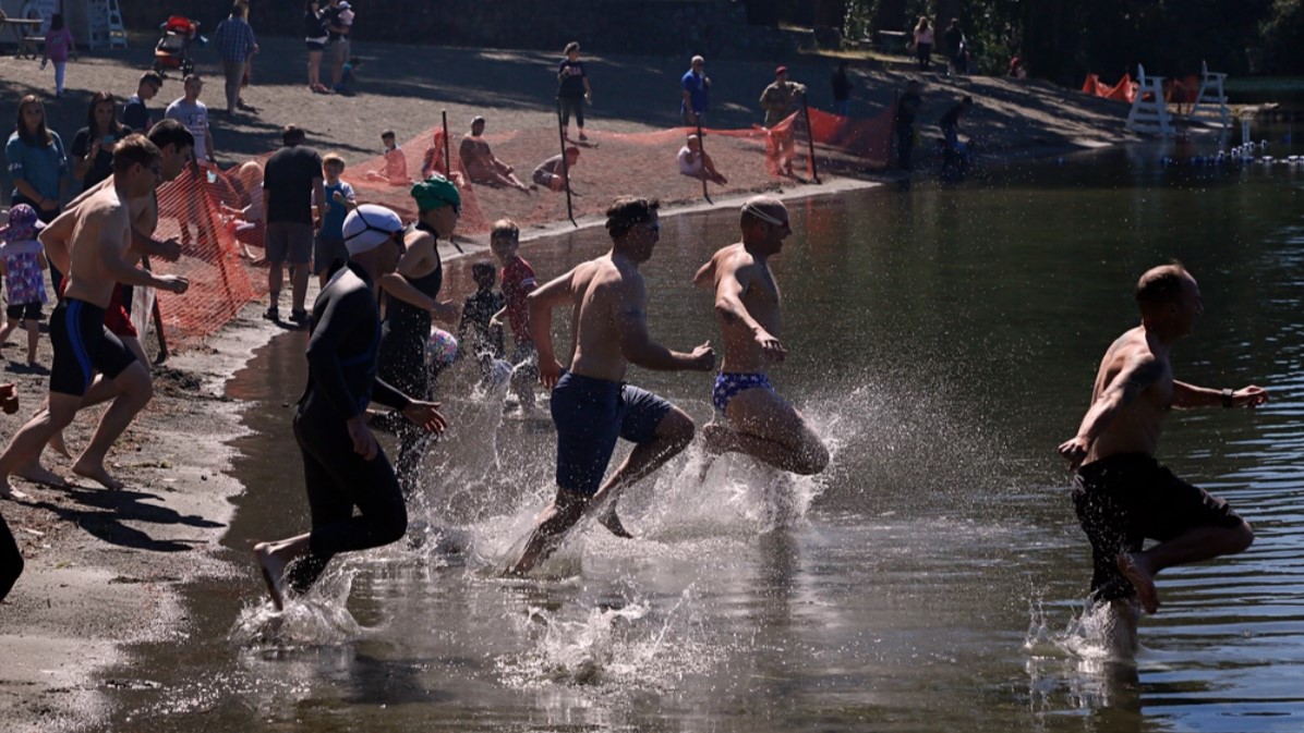 Soldiers with 1st Special Forces Group and their families swim at American Lake at Joint Base Lewis-McChord in 2017. (photo by Sgt. Brandon Welsh/U.S. Army)