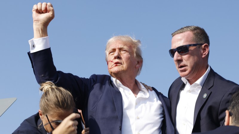 Republican presidential candidate former President Donald Trump is rushed offstage during a rally on July 13, 2024 in Butler, Pennsylvania. Butler County district attorney Richard Goldinger said the shooter is dead after injuring former U.S. President Donald Trump, killing one audience member and injuring another in the shooting. (Photo by Anna Moneymaker/Getty Images)