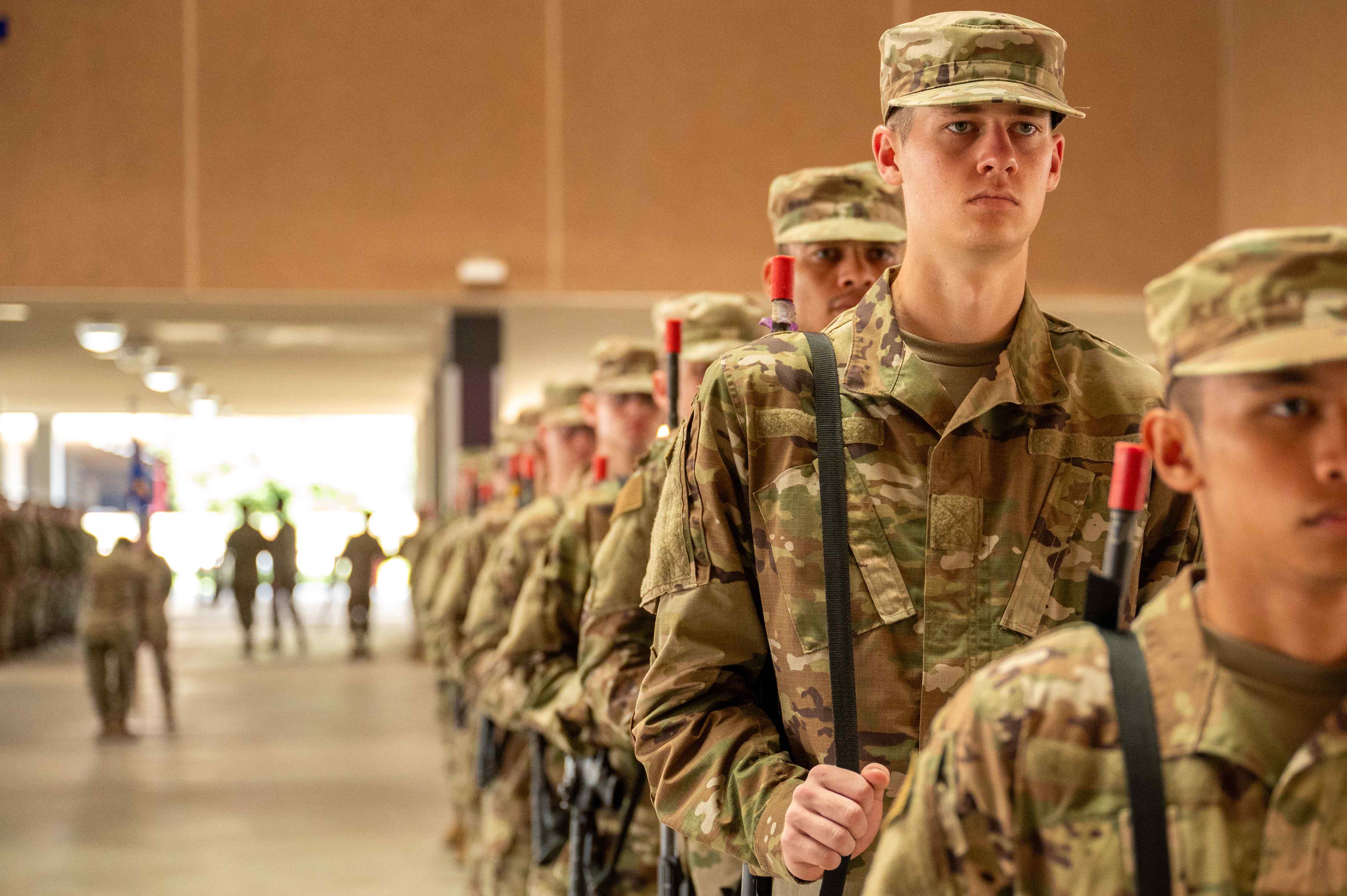 U.S. Air Force Basic Military Training trainees carry weapons at Joint Base San Antonio-Lackland on August 2, 2024. Beginning on July 29, 2024, Col. Billy Wilson Jr., 737th Training Group commander, launched a weapons handling initiative. From now on, BMT trainees will carry weapons throughout their 7.5 weeks of training to instill a profession of arms and a warrior mindset into the future Airmen. JBSA-Lackland is home to USAF BMT where enlisted civilians are transformed into capable Airmen. (U.S. Air Force photo by Ava Leone)