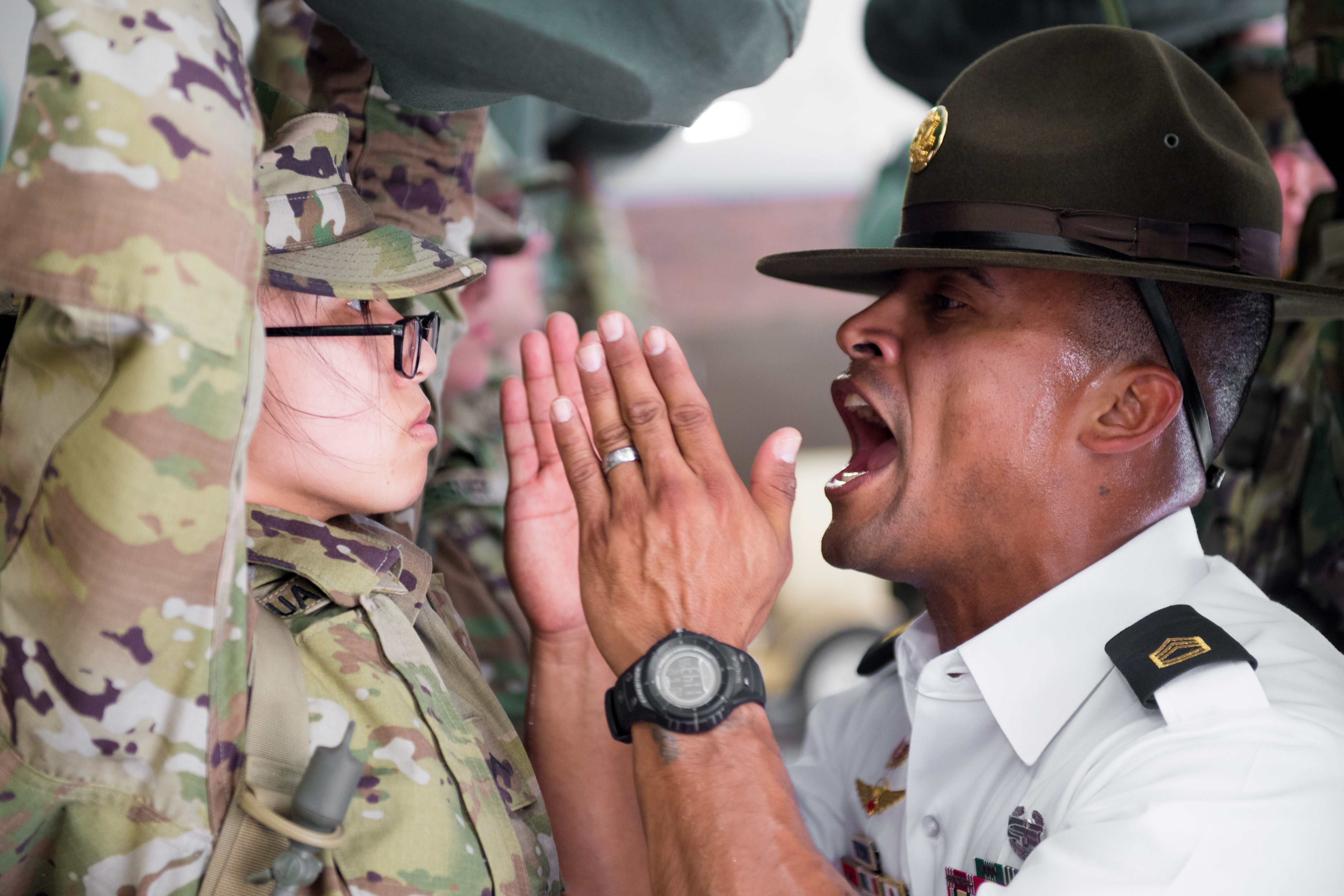 U.S. Army Drill Sergeant Sgt 1st Class. Aleman assigned to Foxtrot 1st Battalion 34th Infantry Regiment participates in the “Shark Attack” or fear stage of the discipline process, as trainees arrive to the First day of Basic Combat Training on 12 June 2017 at Fort Jackson, SC. Among those assigned to the 1st Battalion, 34th Infantry Regiment are Reserve Drill Sergeants from the 3rd Battalion, 518th Infantry Regiment who are required to serve two weeks for annual training (U.S. Army photo by Spc. Darius Davis/Released).