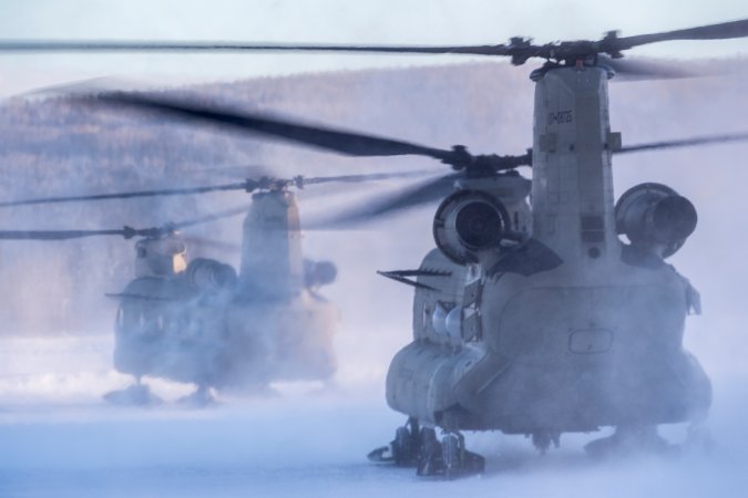 A pair of CH-47 Chinook helicopters assigned to 1st Battalion, 52nd Aviation Regiment, Fort Wainwright, Alaska depart on a mission March 12, 2018, as part of the Joint Force Land Component Command in support of exercise Arctic Edge 18. As the JFLCC for the exercise, U.S. Army Alaska is the headquarters responsible for command and control of all ground-based forces participating in the exercise. Arctic Edge 2018 is a biennial, large-scale, joint training exercise that prepares and tests the U.S. military’s ability to operate tactically in the extreme cold-weather conditions found in Arctic environments. Under the authority of U.S. Northern Command, more than 1500 participants from the Air Force, Army, Coast Guard, Marine Corps, and Navy will utilize the unique and expansive air and ground training areas in Alaska. (U.S. Air Force by Tech. Sgt. Efren Lopez)