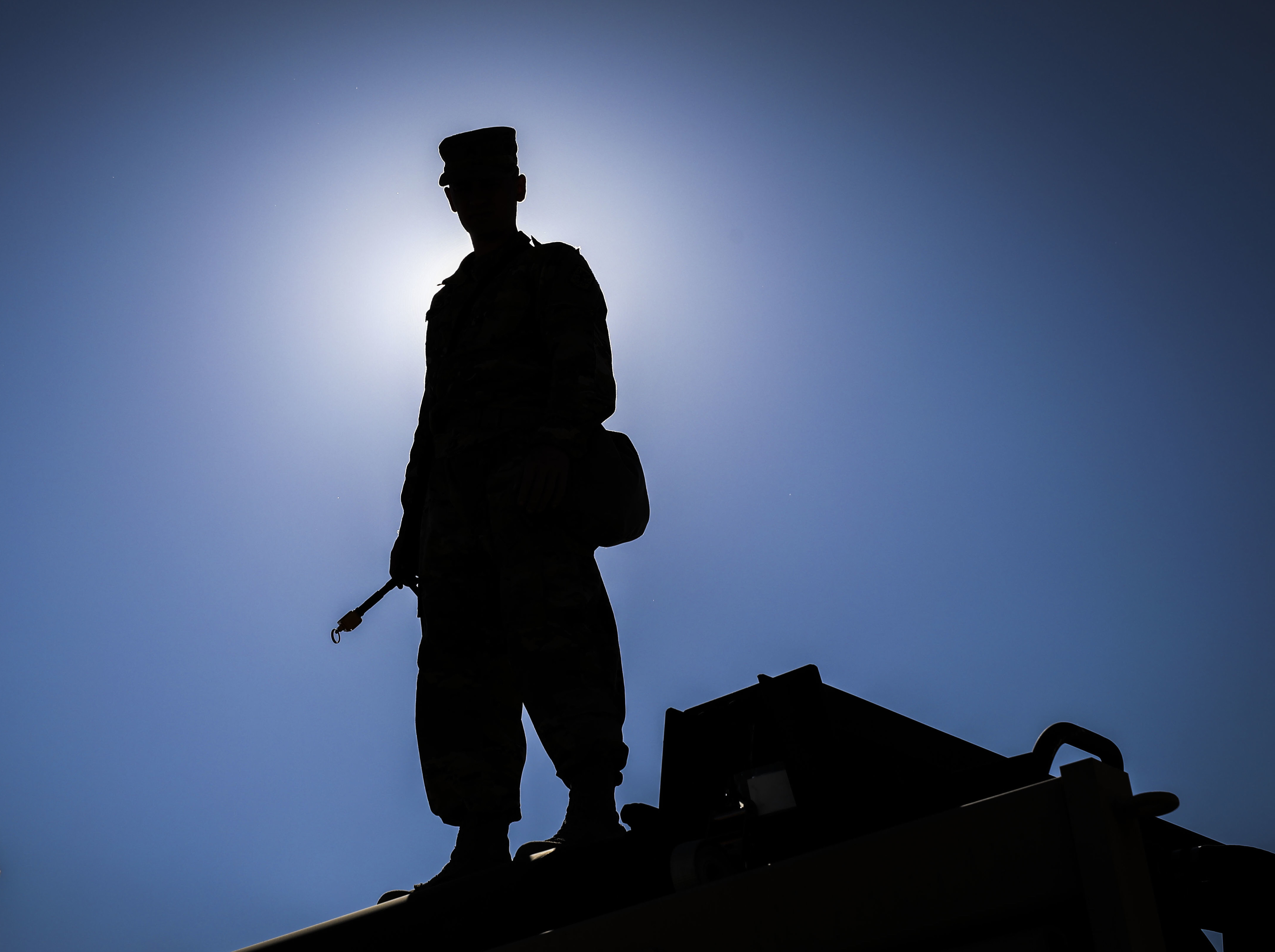 Army Reserve Sgt. Dustin Nelson, a chemical, biological, radiological and nuclear specialist and native of Cleveland, Georgia, assigned to the 327th Chemical Company, 92nd Chemical Battalion, 415th Chemical Brigade, 76th Operational Response Command stands on top of a vehicle and waits for his unit to begin a chemical decontamination mission at Dugway Proving Grounds, Utah, June 19 during Operation Desert Dragon. More than 500 Army Reserve Soldiers from around the country are conducting a variety of specialized training at the base focused on honing Soldiers chemical, biological, radiological and nuclear (CBRN) skill sets and obtaining unit validation as part of a three-week annual exercise known as Operation Desert Dragon. The exercise is designed to be the premiere CBRN validation event for Army Reserve units, and serve as the culminating training event for premobilization and top tier priority units. (Official U.S. Army Reserve photo by Sgt. 1st Class Brent C. Powell)