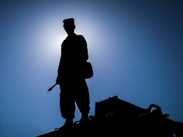 Army Reserve Sgt. Dustin Nelson, a chemical, biological, radiological and nuclear specialist and native of Cleveland, Georgia, assigned to the 327th Chemical Company, 92nd Chemical Battalion, 415th Chemical Brigade, 76th Operational Response Command stands on top of a vehicle and waits for his unit to begin a chemical decontamination mission at Dugway Proving Grounds, Utah, June 19 during Operation Desert Dragon. More than 500 Army Reserve Soldiers from around the country are conducting a variety of specialized training at the base focused on honing Soldiers chemical, biological, radiological and nuclear (CBRN) skill sets and obtaining unit validation as part of a three-week annual exercise known as Operation Desert Dragon. The exercise is designed to be the premiere CBRN validation event for Army Reserve units, and serve as the culminating training event for premobilization and top tier priority units. (Official U.S. Army Reserve photo by Sgt. 1st Class Brent C. Powell)