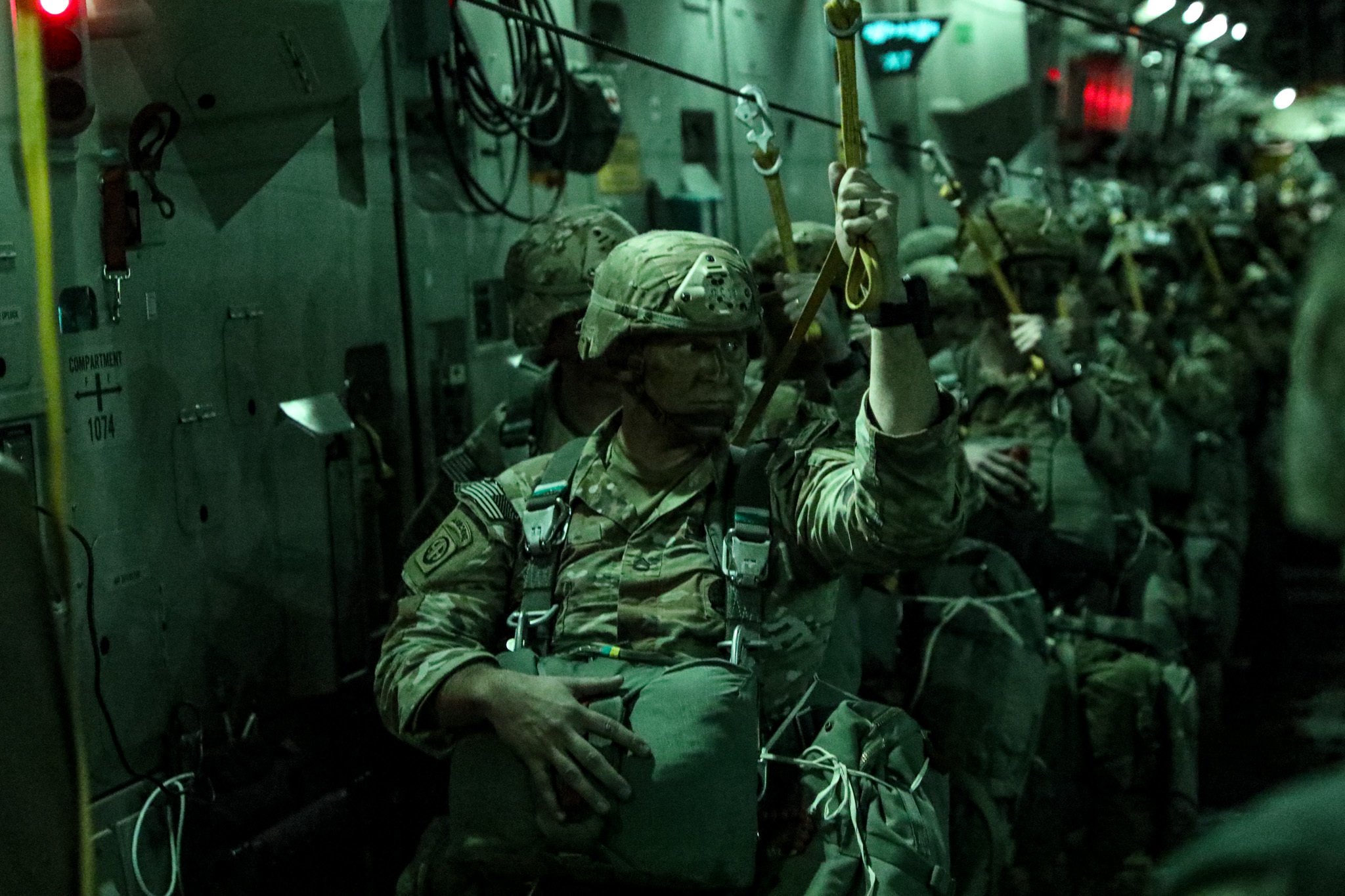 82nd Airborne Division paratrpp[ers prepare for a mass tactical jump from a C-17 Globemaster III.