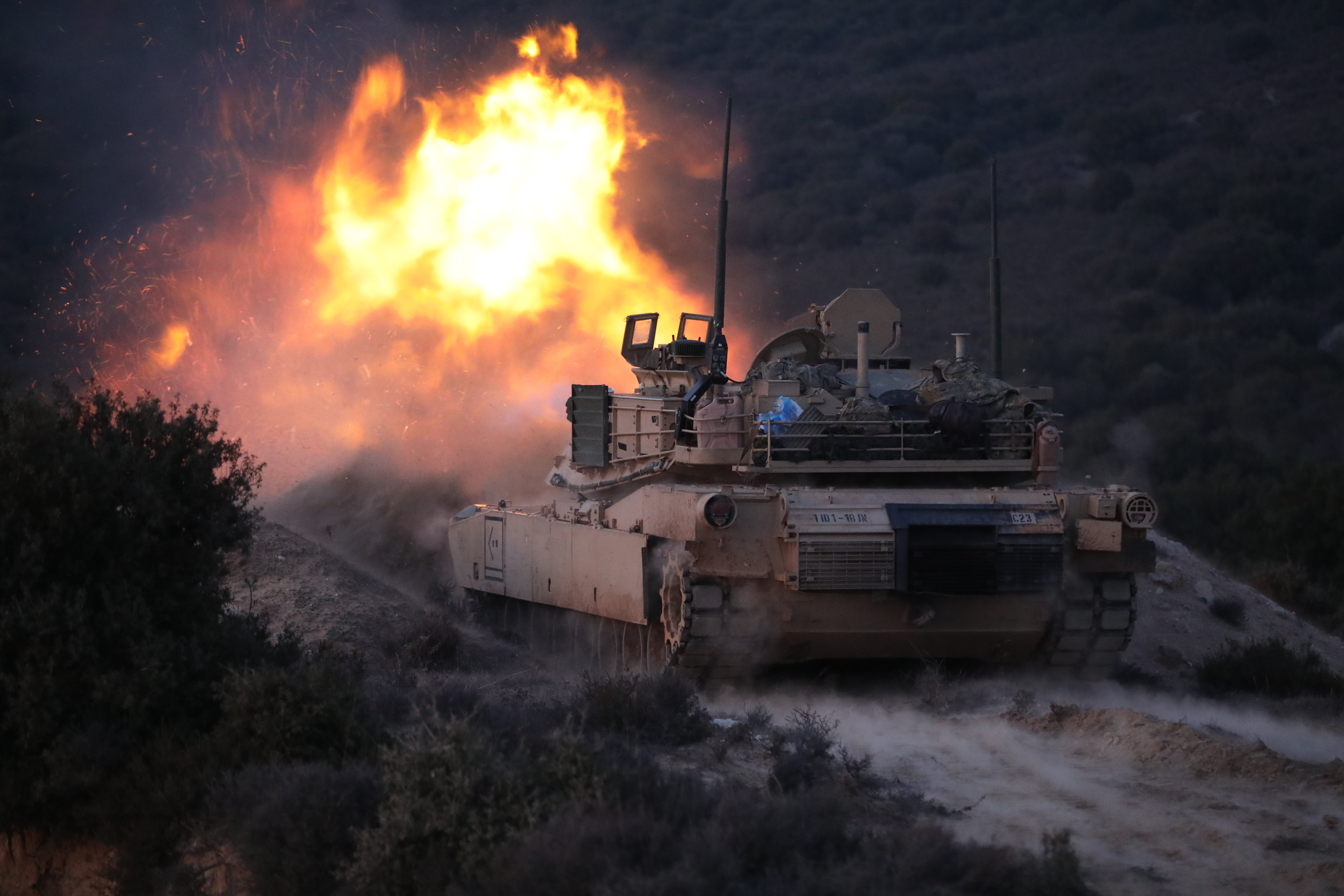 A M1 Abrams Main Battle Tank in 1st Battalion, 18th Infantry Regiment, 1st Infantry Division fires at a prop target during a live fire exercise on Feb. 17, 2023 in Petrochori Training Area, Greece. American armored units along with Greek armored units spent the past couple days training force-on-force and other combat simulation exercises.