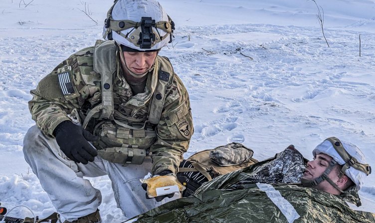 Soldiers with the U.S. Army 11th Airborne Division test a Freeze-Dried Plasma kit as part of combat casualty care training during Joint Pacific Multinational Readiness Center (JPMRC), Fort Wainwright, Alaska, April 2, 2023. FDP is one of several human and canine blood products currently under development by the U.S. Army Medical Materiel Development Activity at Fort Detrick, Maryland. USAMMDA’s Warfighter Protection and Acute Care Project Management team partners with both U.S. Department of Defense and non-DOD industry development partners to develop and deliver blood products for possible future use by the military Joint-Forces. (U.S. Army Courtesy Photo/Released)