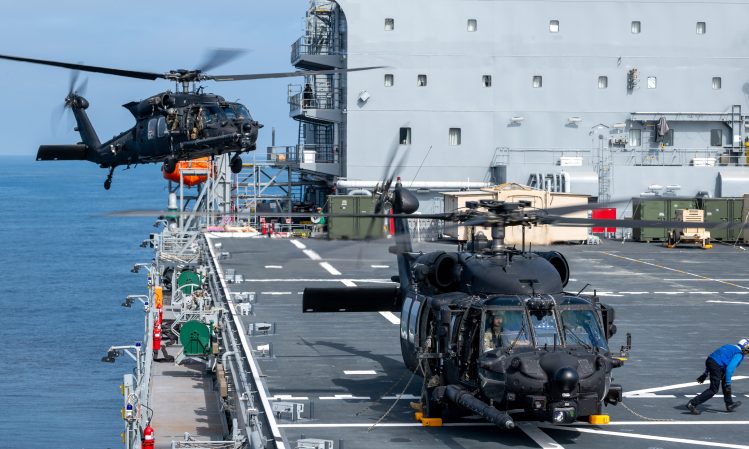 U.S. Army MH-60M helicopters, assigned to the 160th Special Operations Aviation Regiment (Airborne), land on the USS John L. Canley (ESB 6), a U.S. Navy Expeditionary Sea Base ship
