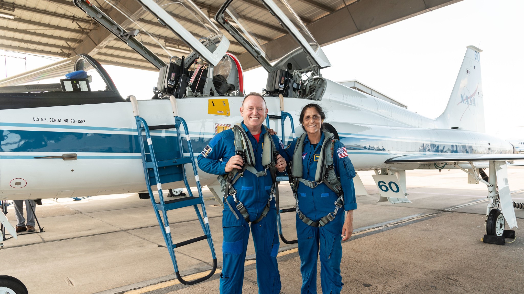 Astronauts Barry "Butch" Wilmore (left) and Sunita "Suni" Williams stand next to a T-38 plane as part of testing for the NASA mission. (photo courtesy NASA)