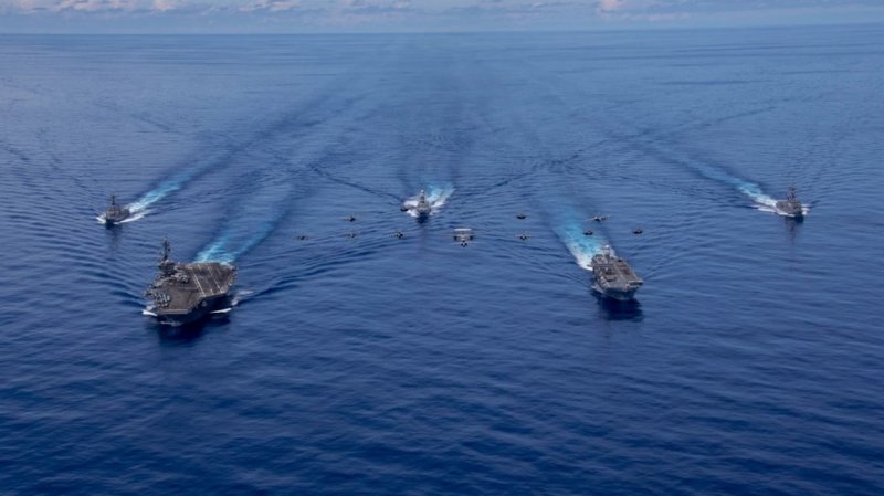 The USS Abraham Lincoln Carrier Strike Group sails through the Pacific Ocean with the Italian Navy's Cavour Carrier Strike Group on Aug. 8, 2024. (photo by Mass Communication Specialist Seaman Apprentice Daniel Kimmelman/U.S. Navy)