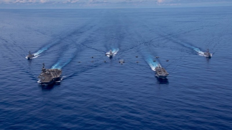 The USS Abraham Lincoln Carrier Strike Group sails through the Pacific Ocean with the Italian Navy's Cavour Carrier Strike Group on Aug. 8, 2024. (photo by Mass Communication Specialist Seaman Apprentice Daniel Kimmelman/U.S. Navy)