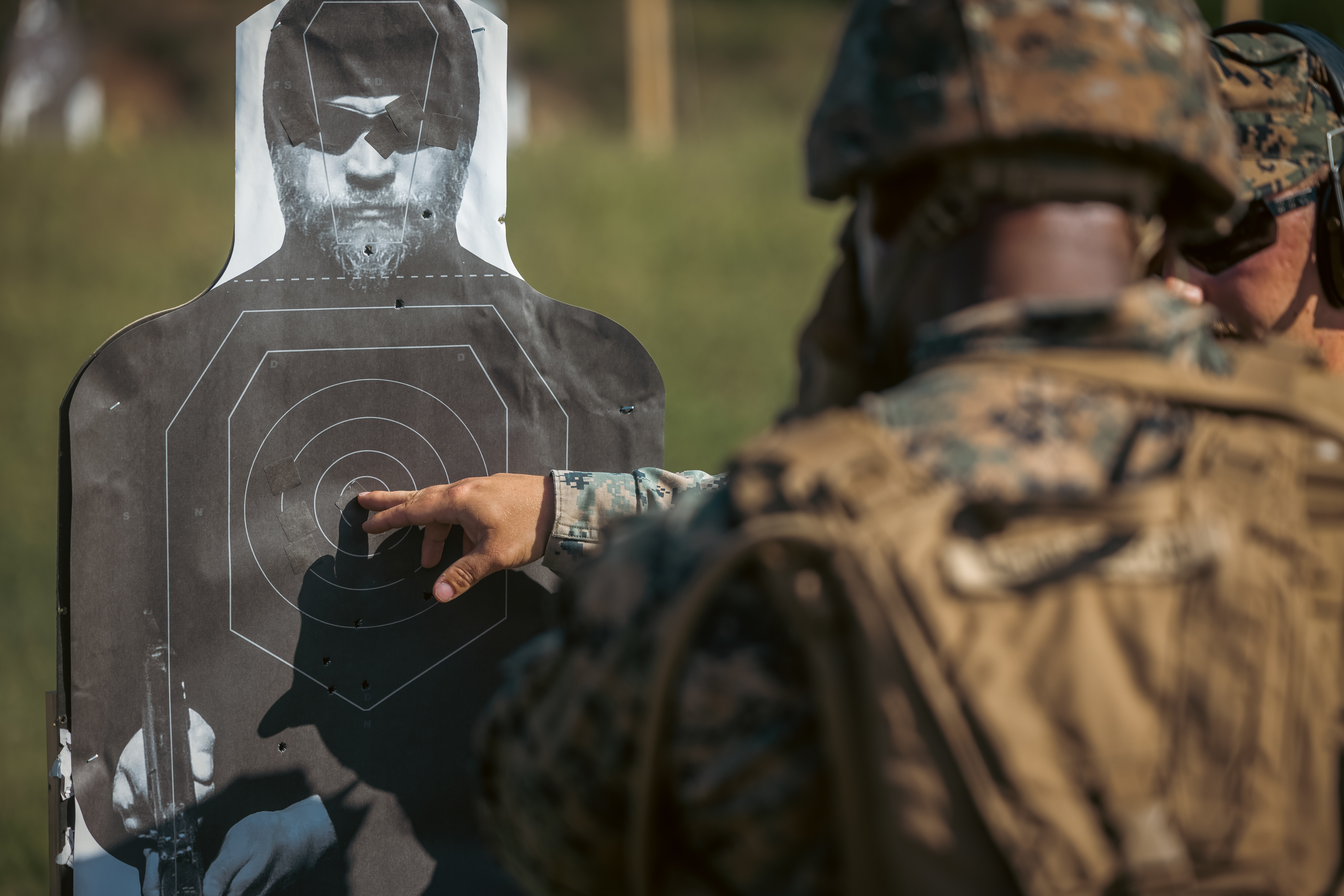 U.S. Marine Corps Brig. Gen. Anthony Henderson, commanding general of Training Command, reviews his shots while participating in various rifle drills at Weapons Training Battalion on Marine Corps Base Quantico, Virginia, Sept. 5, 2024. Training Command develops, sustains, and enhances individual military knowledge, skills, and attitudes in Marines to meet warfighting requirements of the total force. (U.S. Marine Corps photo by Lance Cpl. Ethan Miller)