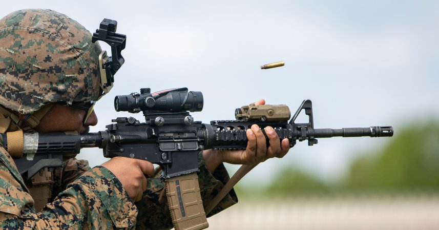 U.S. Marine Corps Pfc. Saul Aguilar-Ortega, an embarkation specialist with 2nd Battalion, 10th Marine Regiment, 2nd Marine Division, engages his target during a new experimental annual rifle qualification (ARQ) on Bravo Range at Stone Bay on Marine Corps Base Camp Lejeune, North Carolina, Sept. 2, 2020. The new ARQ is expected to be implemented by 2021, with shooters wearing combat gear and qualifying over a course of three days. (U.S. Marine Corps photo by Lance Cpl. Christian Ayers)