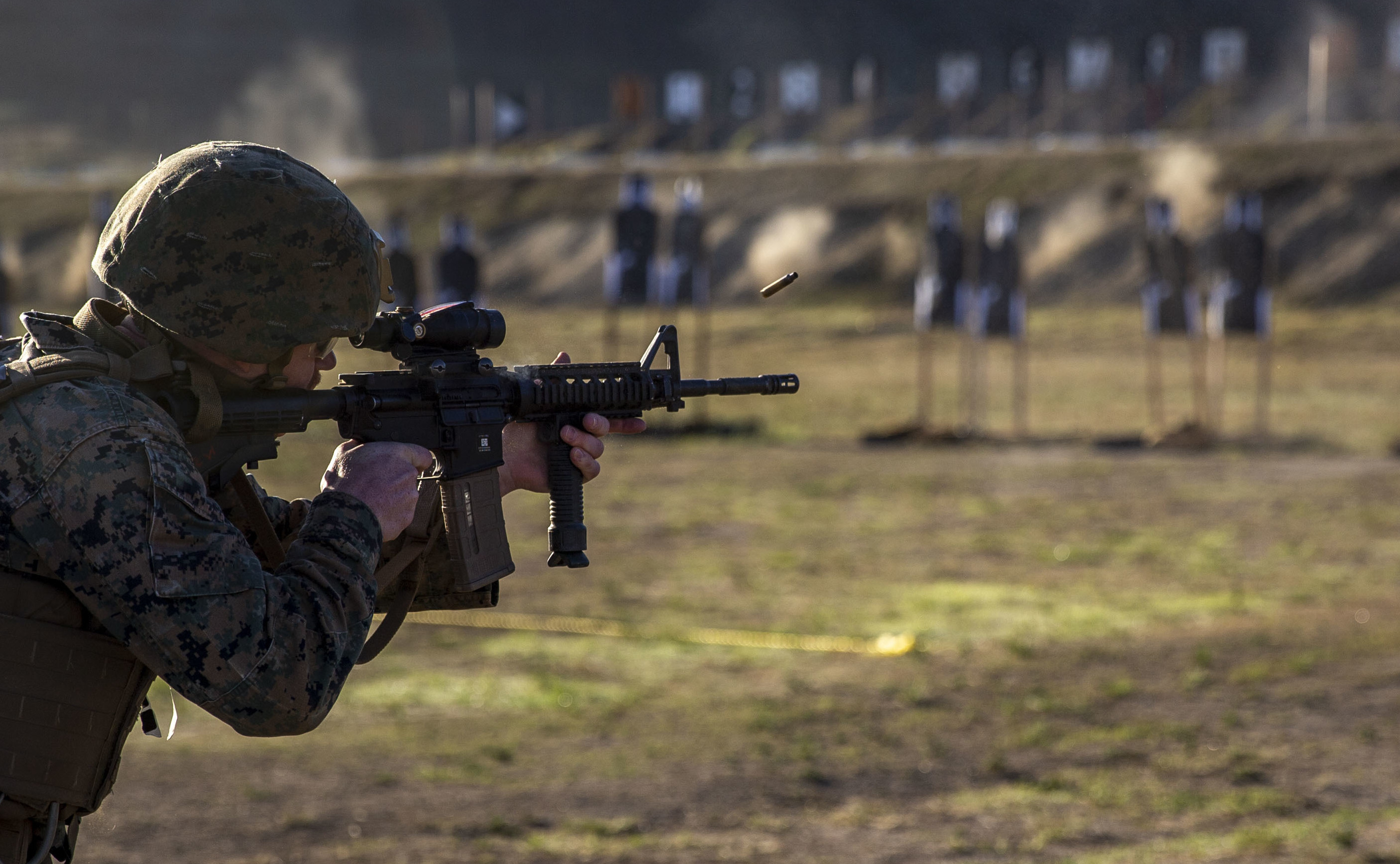 U.S. Marine Cpl. Matthew Kelly, a network administrator with 9th Communication Battalion, I Marine Expeditionary Force Information Group, I Marine Expeditionary Force, fires an M4 carbine during the first day of the new annual rifle qualification at Range 116A on Marine Corps Base Camp Pendleton, California, Oct. 19, 2021. The new qualification features a three-day course of fire emphasizing lethality and positional shooting. The three days break down into a practice day, pre-qualification and qualification. Kelly is a native of Huntsville, Alabama. (U.S. Marine Corps photo by Lance Cpl. Kerstin Roberts)