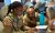 U.S. Army Lt. Briana Harvey, team lead for CPT 169 during CYBER FLAG 22, assists another soldier with a computer issue at the Laurel Readiness Center, Laurel, MD during CYBER FLAG 22 on Jul. 25, 2022. Cyber Flag 22 is an annual U.S. Cyber Command training event that is designed to strengthen partnerships, improve the defensive skills, and enhance the readiness and collaboration of the participating cyber operators. (U.S. Army National Guard photo by Sgt. Tom Lamb)