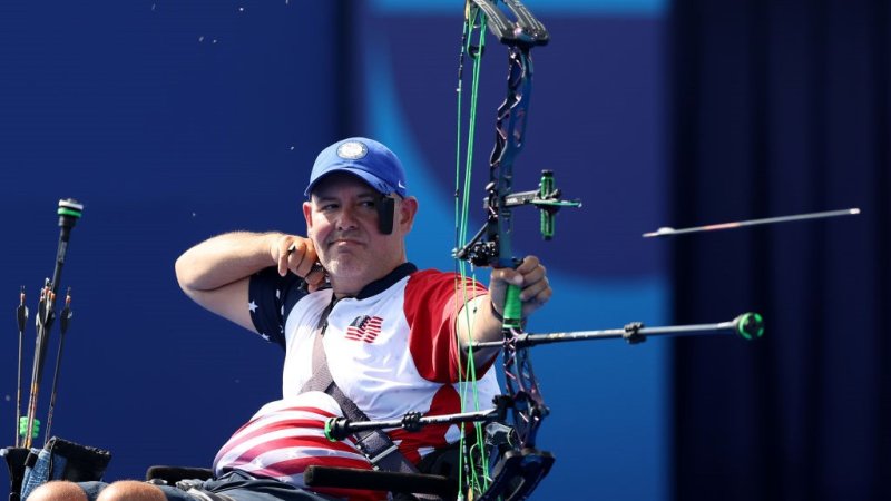 Army veteran Jason Tabansky fires an arrow at the 2024 Paralympic Games.