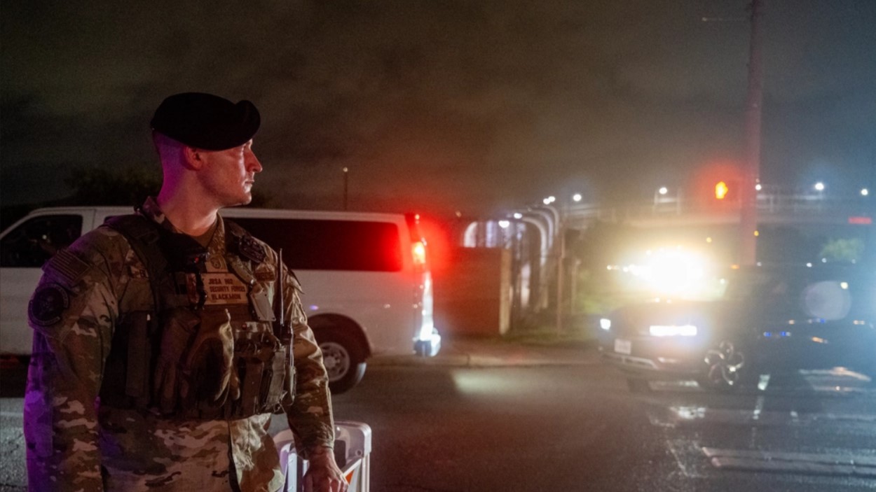 U.S. Air Force Master Sgt. Alec Blackmon with the 802nd Security Forces Squadron stands outside a gate at Joint Base San Antonio-Lackland in June 2024. (U.S. Air Force photo by Brian Boisvert)