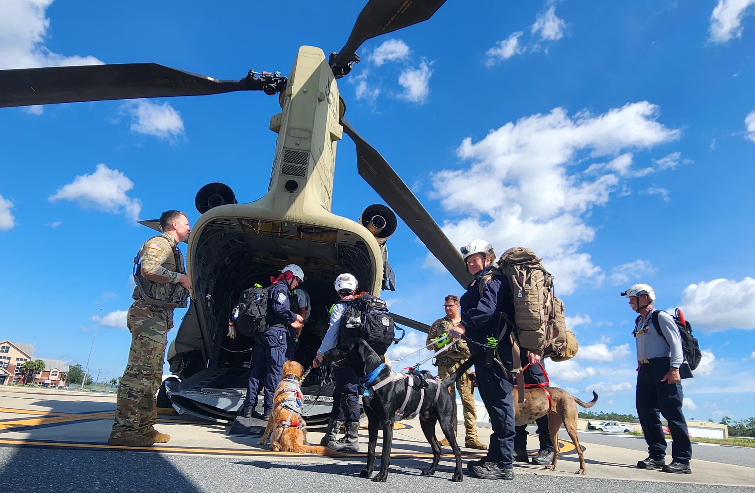 Members of the Texas A&M Task Force 1 Search and Rescue Team work alongside Soldiers from the HHC 1-111th AVN GSAV (General Support Aviation) to conduct search and rescue operations after Hurricane Helene, Sept. 27, 2024. The Florida Army National Guard works closely with our civilian partner agencies and actively monitors all potential areas of impact. (U.S. Army photo by Capt. Valeria M. Pete, 107th MPAD, FLARNG)