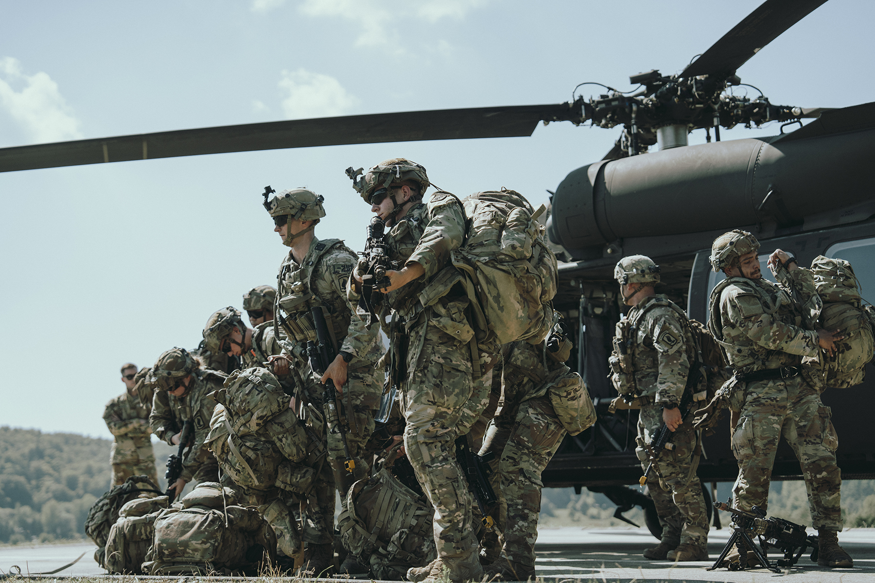 U.S. Army paratroopers assigned to the 173rd Airborne Brigade conduct cold load training on UH-60 Blackhawk and CH-47 Chinook helicopters as part of exercise Saber Junction 24 in Hohenfels, Germany, Aug. 29, 2024. Saber Junction 24 is a multinational rotational exercise designed to assess the readiness of the U.S. Army's 173rd Airborne Brigade to execute unified land operations in a joint, combined environment and to promote interoperability with more than 4,500 participants from the U.S. and Allied and partner nations at Hohenfels training area. The 173rd Airborne Brigade is the U.S. Army's Contingency Response Force in Europe, providing rapidly deployable forces to the United States European, African, and Central Command areas of responsibility. Forward deployed across Italy and Germany, the brigade routinely trains alongside NATO allies and partners to build partnerships and strengthen the alliance. (U.S. Army photo by Sgt. Joskanny J. Lua)