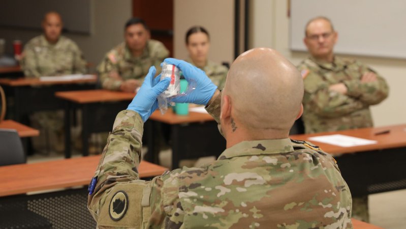 Hawaii Army National Guard (HIARNG) Soldier Sgt. 1st Class Thomas A. Foster, HIARNG drug testing coordinator, demonstrates how to properly place a seal on a testing bottle during a Unit Prevention Leader (UPL) Certification Training course, Pearl City, Hawaii, November 14-15, 2022. As a certified UPL they are expected to be the Commander’s subject matter expert on all areas of the Army Substance Abuse Program, to conduct urinalysis collections and assist the Commander in the administration of Unit drug testing. (U.S. Army National Guard photo by Spc. Mariah-Alexsandra K. Manandic-Kapu)